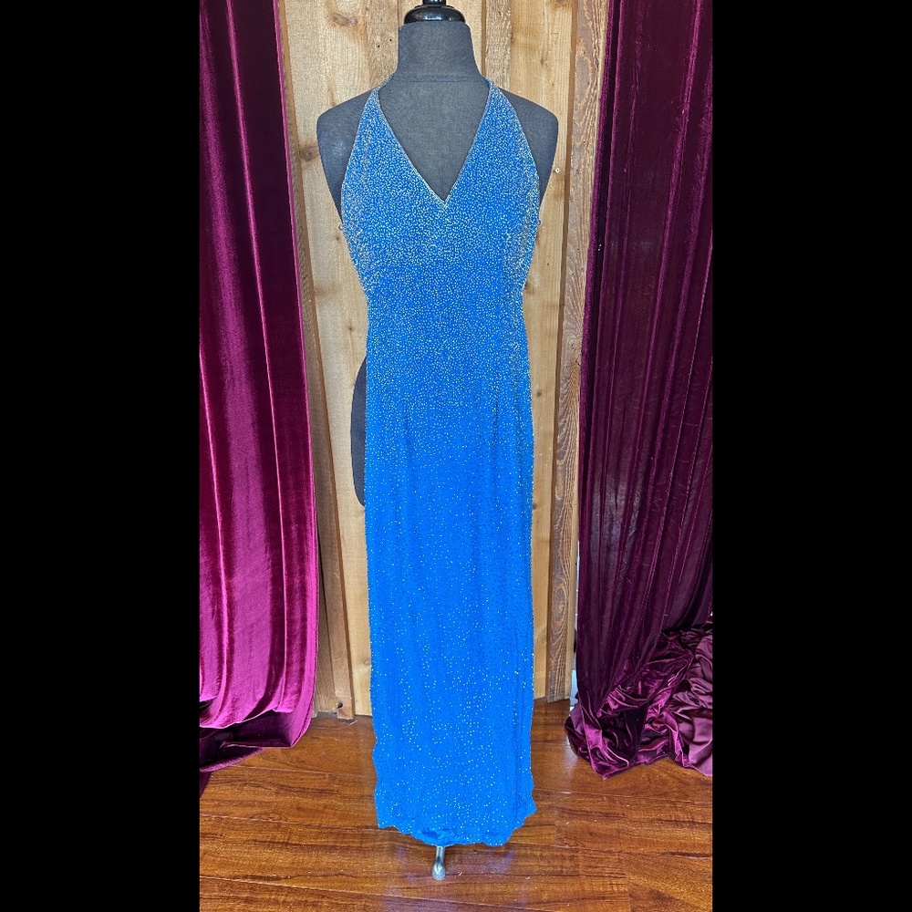 Lovely blue backless evening gown with beads and strap neck